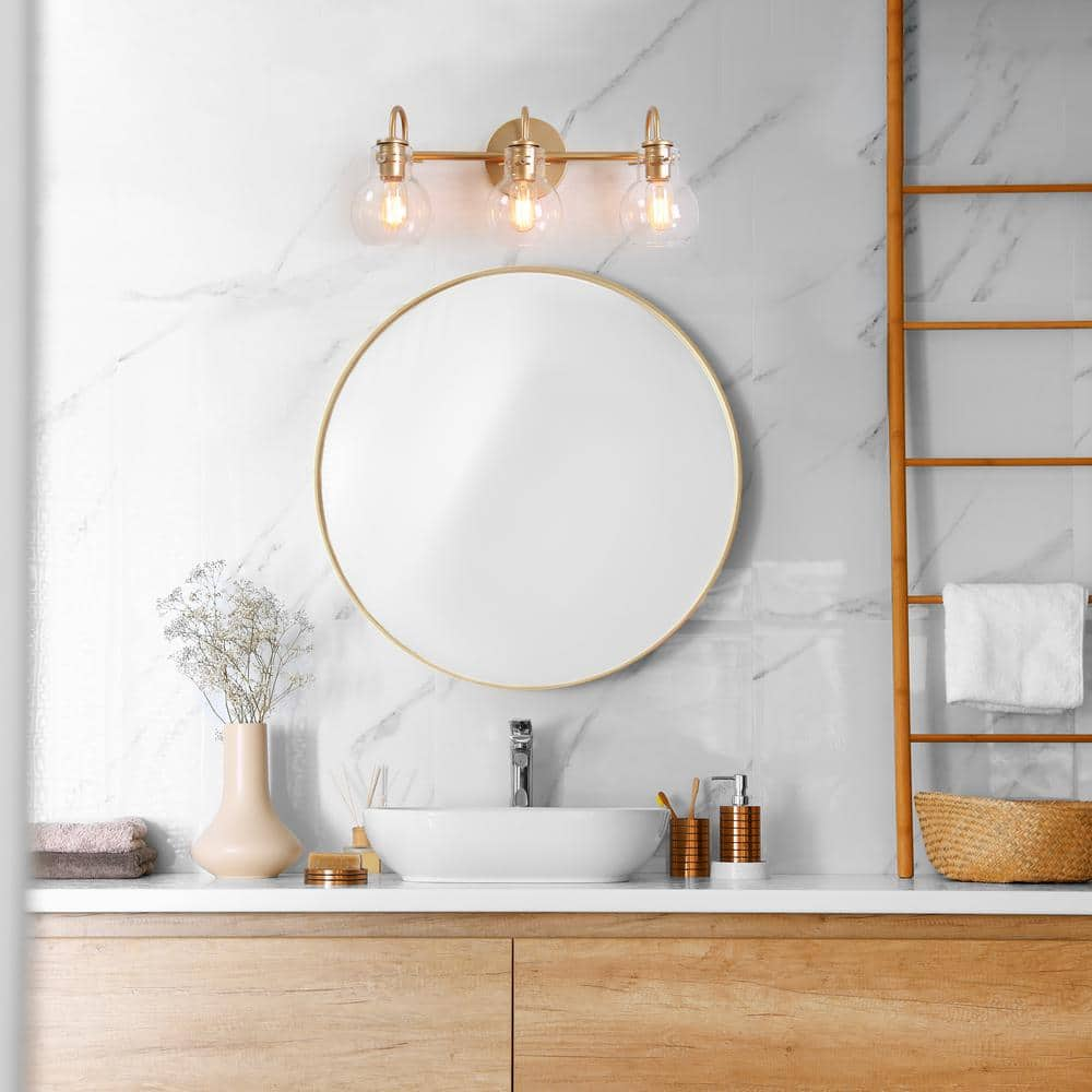 LALUZ Stockton Modern 3-Light Gold Bathroom Vanity Light Powder Room Wall Sconce with Clear Globe Glass Shades