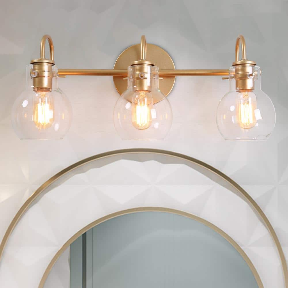 LALUZ Stockton Modern 3-Light Gold Bathroom Vanity Light Powder Room Wall Sconce with Clear Globe Glass Shades